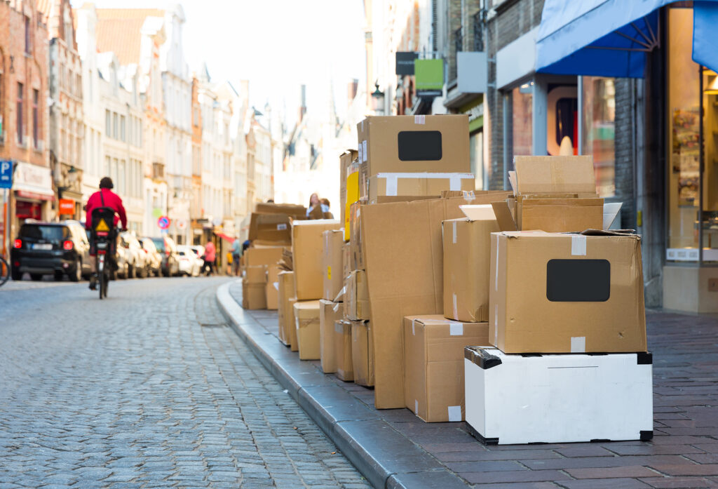 Carton garbage boxes on sidewalk, european city